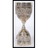 A Siam silver continental goose egg / duck cup combination bearing figures / deity cast in relief