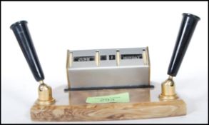 Two 20th Century desk items to include a vintage retro desk calendar having two pen holders to the
