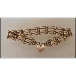 A 9ct gold hallmarked link bracelet with heart shaped clasp, Sheffield assay mark. 7" long and