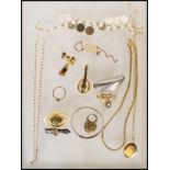 A quantity of vintage and later costume jewellery to include a silver ingot on chain, marcasite