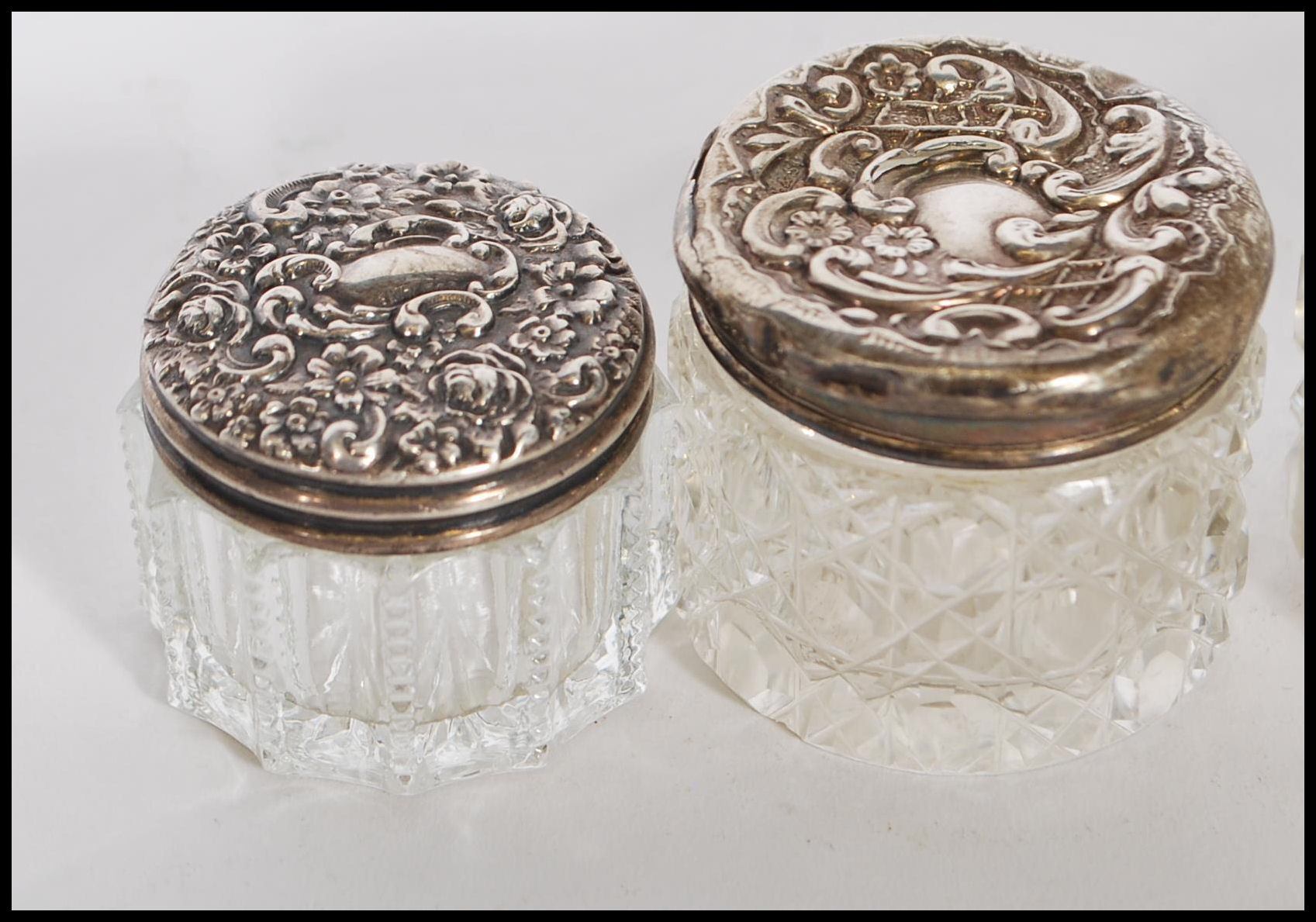 A group of early 20th Century silver topped and cut glass bodied dressing table pots, most having - Image 3 of 11