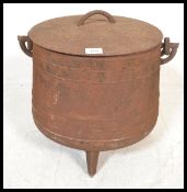 A large vintage 20th Century cast iron pot bellied