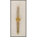 A vintage Longines Quartz slim line wrist watch having an oversized round face with gilt baton