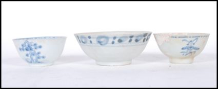 A group of 19th and 18th Century Chinese porcelain tea bowls to include two Tek Sing cargo blue