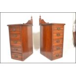A pair of late 19th Century high Victorian mahogany pedestal chest of drawers / bedside cabinets,