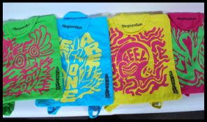 A set of four tote rucksack bags from the 2015 Glastonbury music festival issued by the Guardian