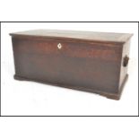 A 19th Century Georgian oak blanket box chest, hinged top with carry handles to the side, bone
