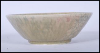 An early 20th century Ruskin Pottery bowl, with a greenish crystalline glaze being stamped 1927.