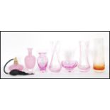 A collection of retro pink studio glass to include a pair of pink glass Caithness vases, a Caithness