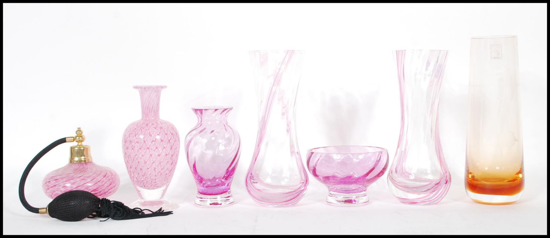 A collection of retro pink studio glass to include a pair of pink glass Caithness vases, a Caithness