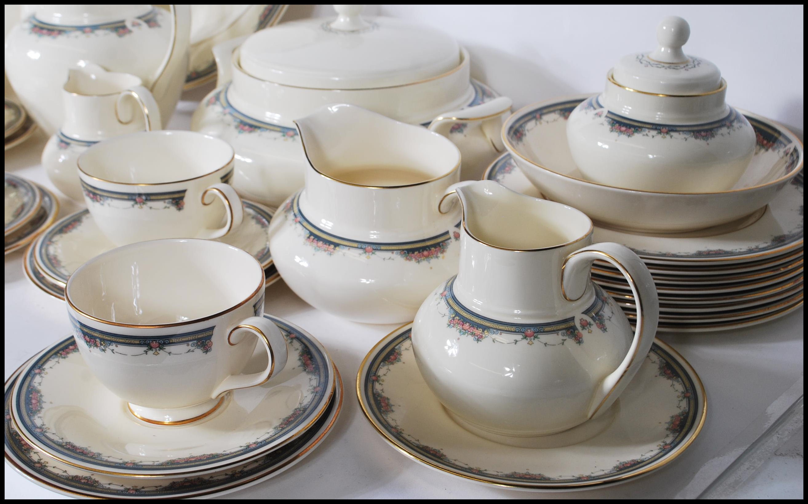 A 20th Century dinner and tea service by Royal Doulton in the Albany pattern having ivory white - Image 9 of 11