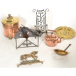 A collection of brass wares dating from the 19th Century onwards to include a large copper coal