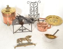 A collection of brass wares dating from the 19th Century onwards to include a large copper coal