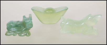 A collection of 3 Chinese jade figural sculptures to include a boat, a temple dog and a Qulin