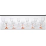 A collection of early 20th century wine glasses / sherry and port glasses to include 10 x facet