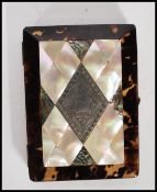A late 19th Century / early 20th Century calling card case having a central mother of pearl panel
