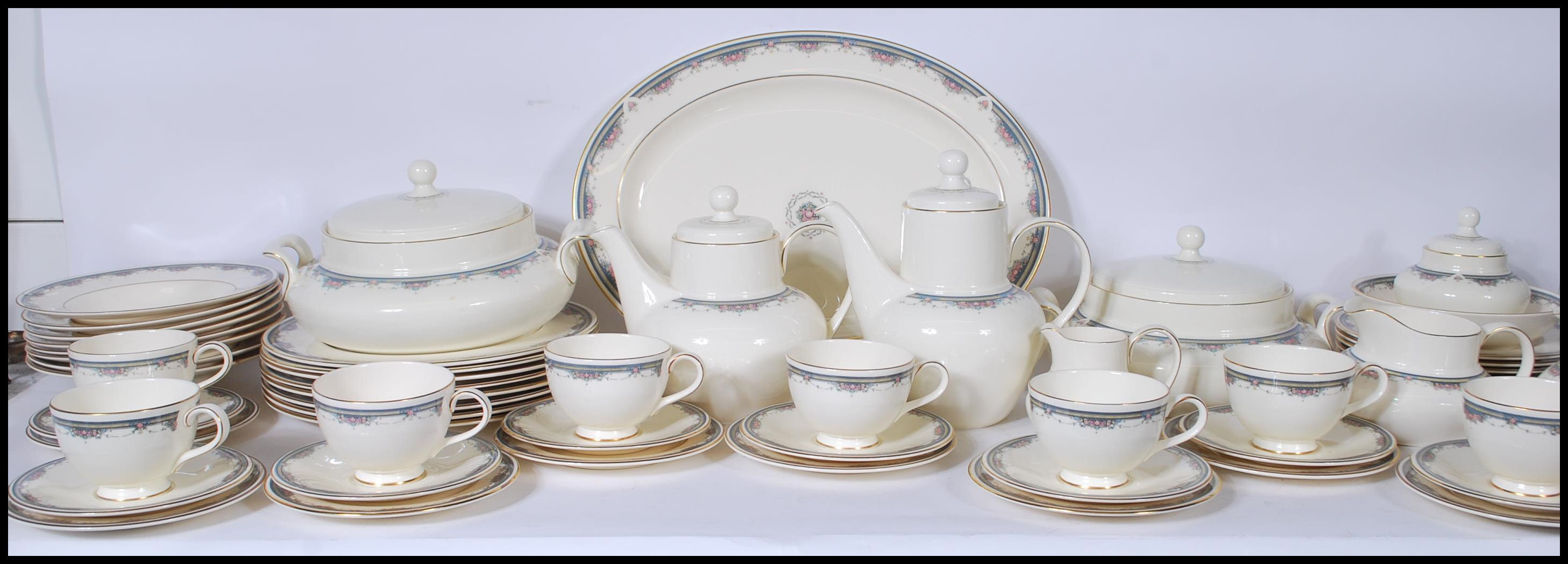 A 20th Century dinner and tea service by Royal Doulton in the Albany pattern having ivory white