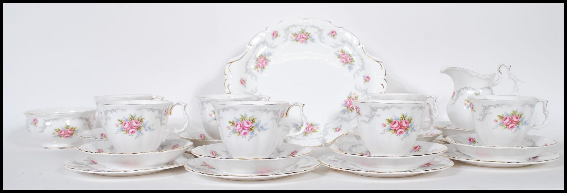 A Royal Albert tea service in the Tranquillity pattern having floral and gray foliate decoration
