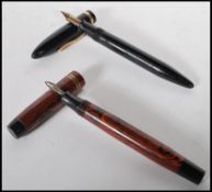 A lever fill fountain pen by Sheaffer having black finish with gilt metal detailing to lid. Together