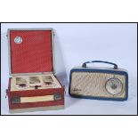 A vintage 20th Century cased Vidor portable radio having hinged lid and carrying handle finished