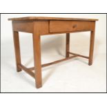 A 19th century French fruitwood  dining table. Raised on squared legs united by stretcher having a