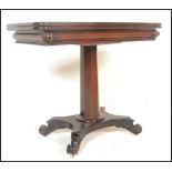 A 19th century Regency solid mahogany tea table. Raised on a quadruped base with scroll feet.