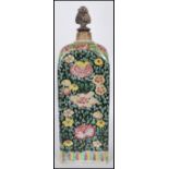 A 19th century Chinese / Canton  tall square pottery flask of famille rose design being set with a