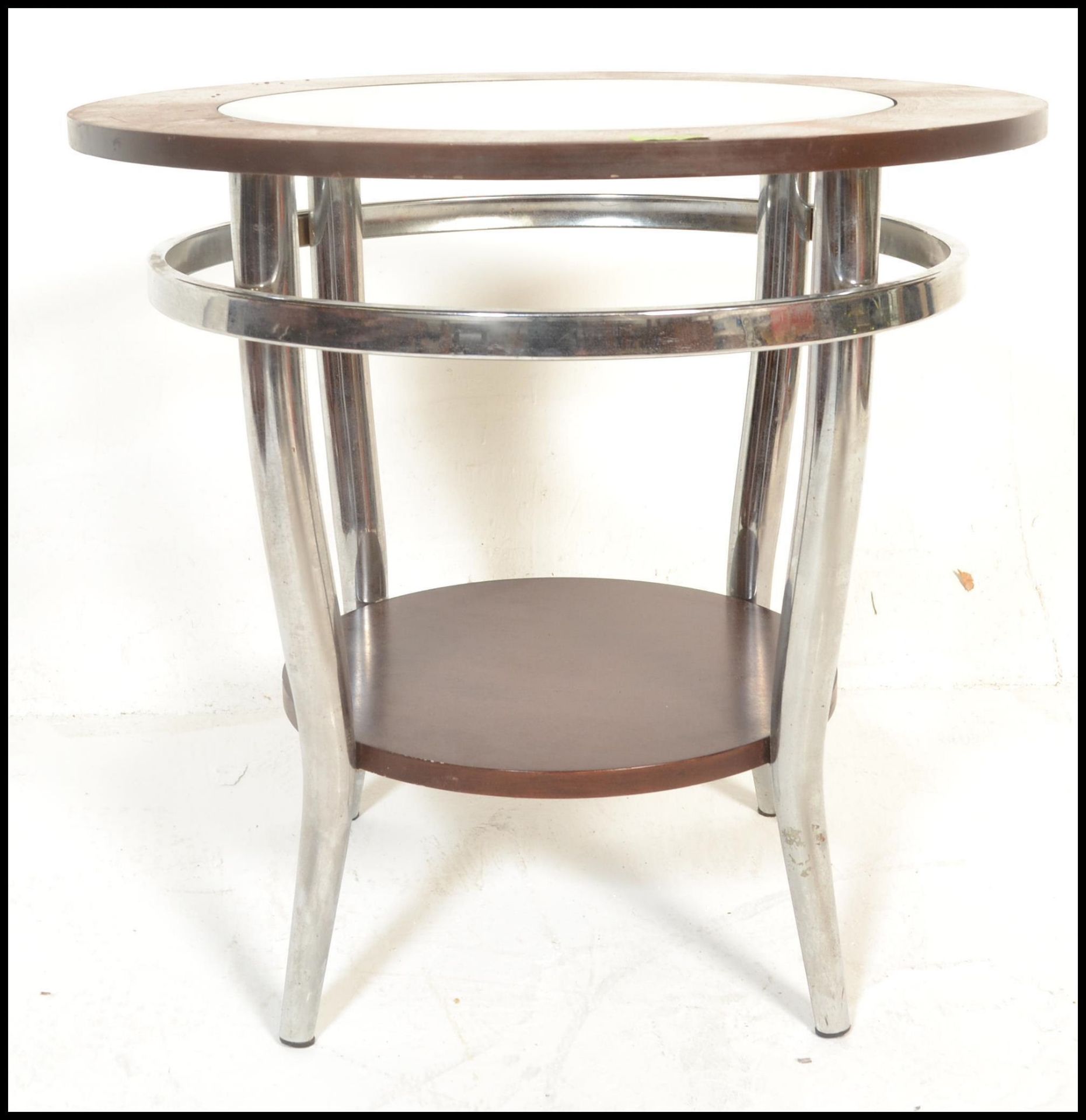 A retro style circular coffee / side / occasional table, raised on a chrome tubular frame united