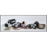 A collection of 20th Century vintage cameras to include Empire Baby the wonder boxed camera, Bell