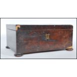 A early 19th Century Georgian flame mahogany work box of square form raised on flat bun feet, the