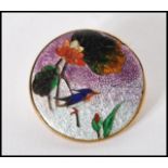 A vintage 20th Century Cloisonne enamelled brooch of round form depicting a kingfisher perched on