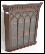 A 19th century mahogany hanging corner cabinet of