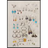 A collection of silver earrings to include drop earrings, stud earrings and hoop earrings, three