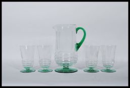 A early 20th Century Art Deco glass lemonade set having etched detailing with green circular