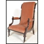 A 19th century Victorian mahogany Library / Salon chair upholstered in a ochre pinkish hue velour