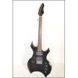 A heavy metal style six string electric guitar made by Stagg, finished in black having having chrome