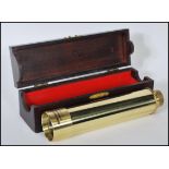 A contemporary Japanese made brass Swallow Commander 30 x 40 three draw telescope, in mahogany