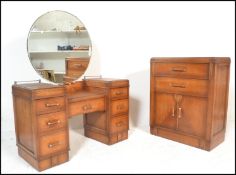 A early 20th Century 1930's Art Deco oak dressing table, having large circular mirror to center