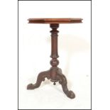 A 19th Century Victorian mahogany wine occasional table raised on carved tripod base. The