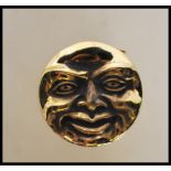 An unusual brass cased vesta in the form of the man in the moon. Polished brass with hinged strike