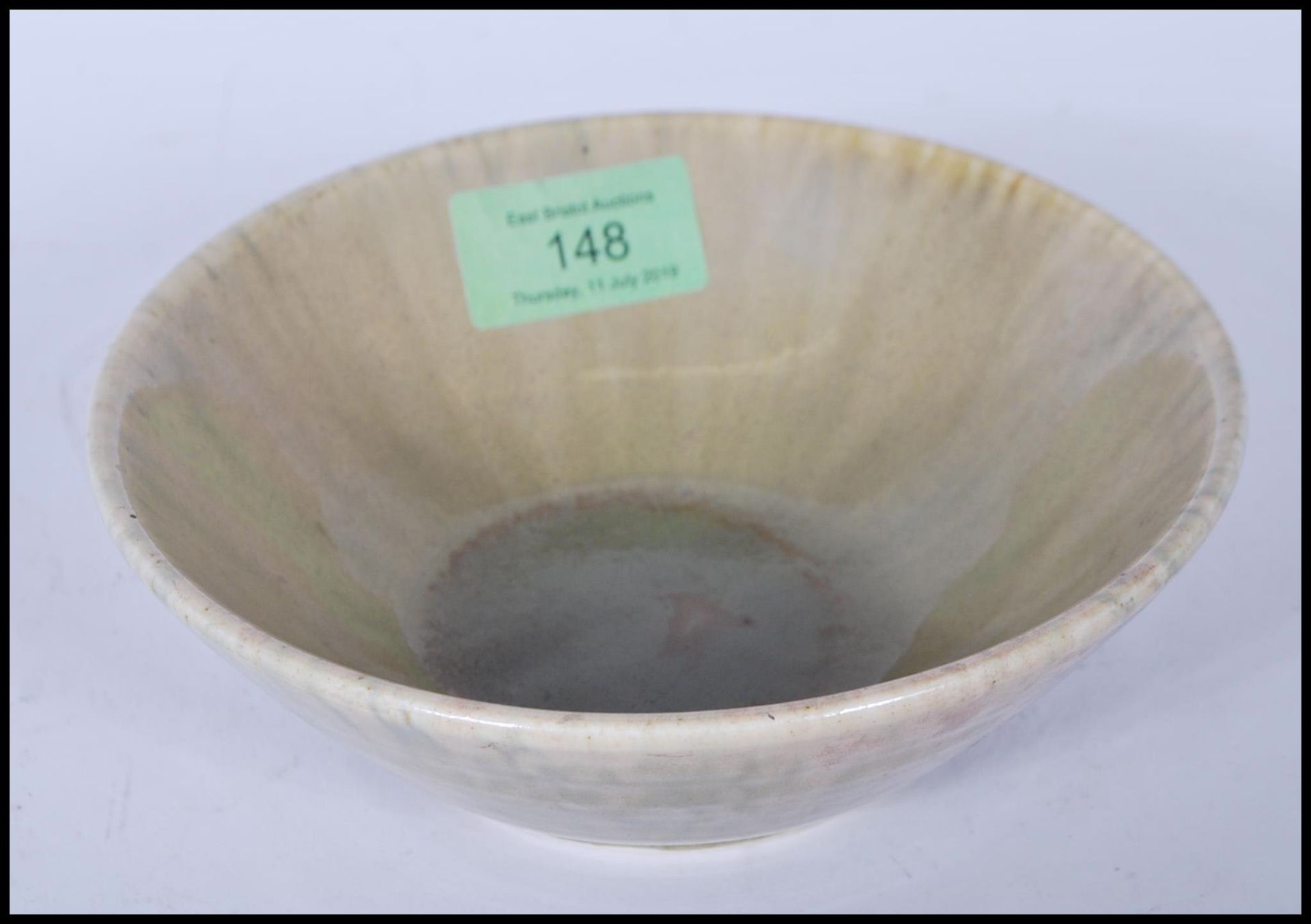 An early 20th century Ruskin Pottery bowl, with a greenish crystalline glaze being stamped 1927. - Image 2 of 5