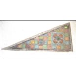 An early 19th Century leaded stained glass Arts and Crafts architectural panel of triangular /