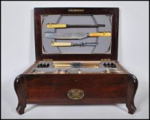 An early 20th century mahogany cased Viners canteen of cutlery having twin sections, one drawer