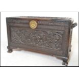 A good mid century 20th century Chinese camphor wood chest / trunk being carved in relief with