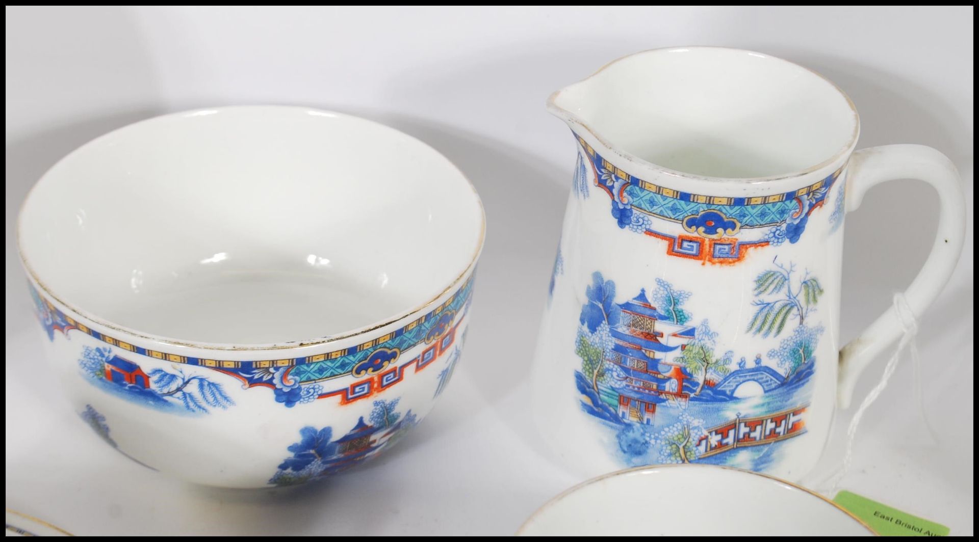 A 20th Century Staffordshire blue and white tea service in the Willow pattern, having red and - Image 5 of 8