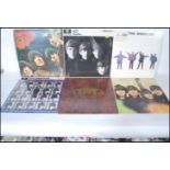 A collection of six vinyl long play LP album records by The Beatles to include Rubber Soul, Love