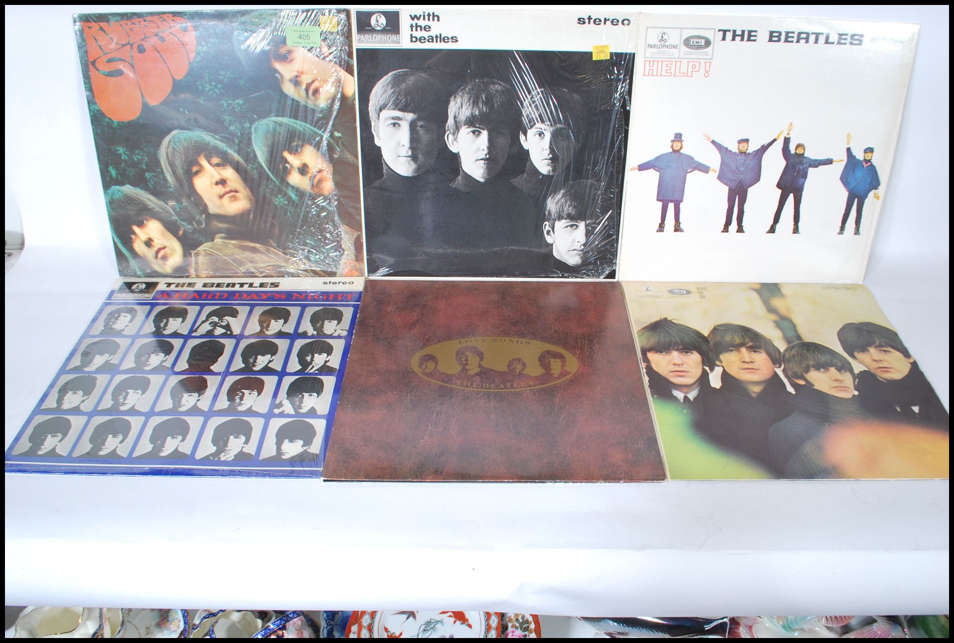 A collection of six vinyl long play LP album records by The Beatles to include Rubber Soul, Love