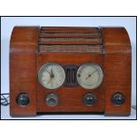 A vintage mid 20th Century walnut cased Goblin  "Time Spot" valve radio, featuring a 8-inch