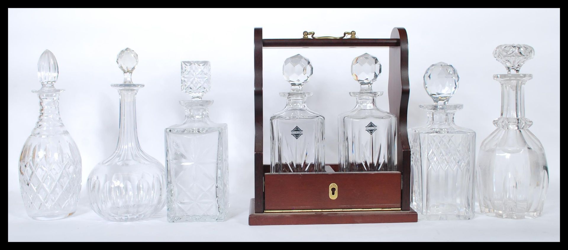 A collection of 20th century decanters to include facet cut, cut glass crystal and other shapes