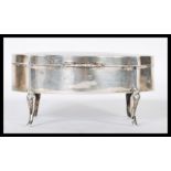 A late Victorian silver hallmarked ladies jewellery casket being raised on cabriole legs with engine